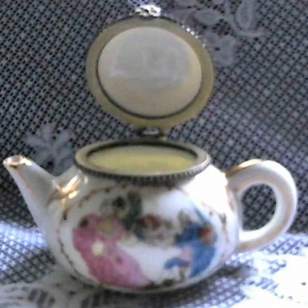 beautiful little Victorian tea pot jewelry holder